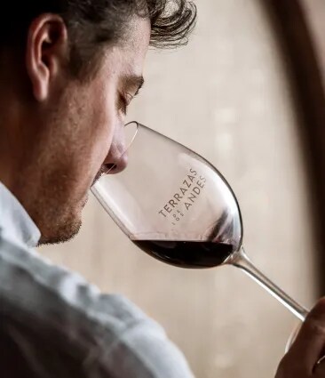 Terrazas de los Andes' Enologist indulging in a glass of our high-altitude Malbec, a hallmark of Argentina's famous Mendoza wine region, known for its exceptional Argentinian red wines.